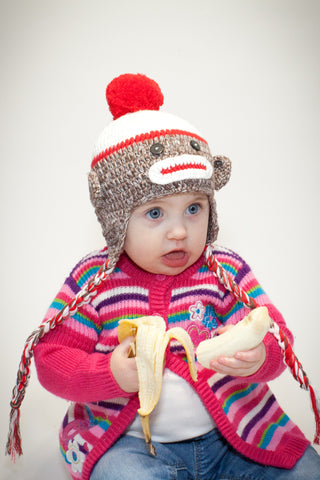 Sock monkey hat with pom-pom